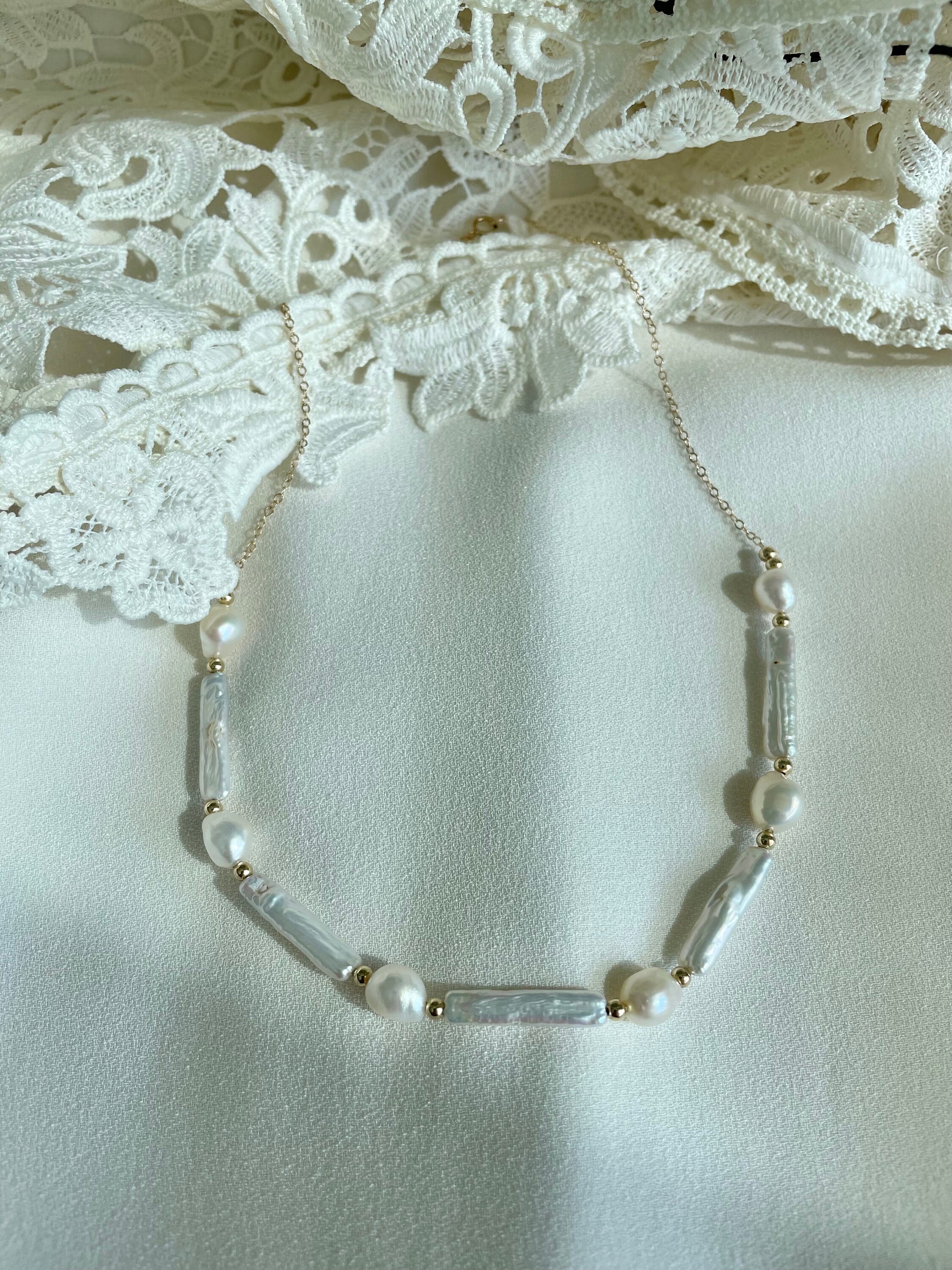 Collana/bracciale/orecchini di perle barocche d'acqua dolce bianche