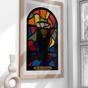 May include: A framed print of a stained glass window design featuring a glass of Guinness beer. The window is made up of colorful pieces of glass in shades of red, orange, yellow, green, blue, and purple. The text at the bottom of the print reads "St. Arthur Guinness."