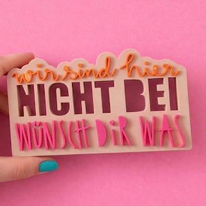 May include: A set of three ceramic mugs with a speckled, matte finish. The mugs are in shades of cream, light brown, and dark brown. Each mug has a simple, minimalist design, perfect for coffee or tea.