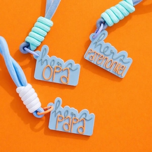 May include: A white ceramic mug with a black handle and the text "But First, Coffee" in a bold, black font. The mug is set against a blurred background, highlighting its clean design.