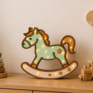 May include: A wooden rocking horse-shaped night light with a green body and star accents. The light is surrounded by other wooden toys, including a train and a stacking ring toy. The words "INSTANT DOWNLOAD" are at the top.