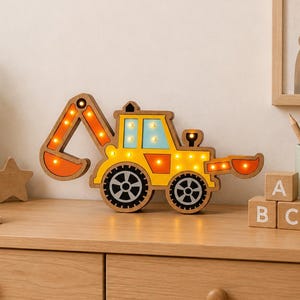 May include: A wooden, light-up excavator toy with a yellow body, orange arm, and black wheels. The excavator has a blue windshield and is decorated with small lights. The image also includes the text "SVG DXF DWG AI PNG" and "INSTANT DOWNLOAD".