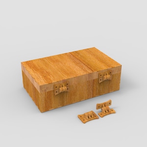 May include: A rectangular wooden box with a hinged lid and two detached hinges. The box is made of light brown wood with visible grain and has a simple, classic design. The hinges are also made of wood and are a lighter shade of brown.