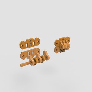 May include: A disassembled wooden toy with a light brown finish. The toy consists of several interlocking pieces, including a crank, gears, and mounting plates. The pieces are arranged to show how they fit together. The toy appears to be a mechanical puzzle or educational item.