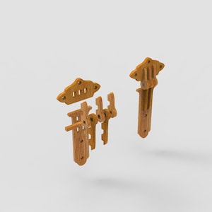 May include: Wooden cabinet hardware set, featuring a decorative design. The set includes multiple pieces, including a latch, hinges, and mounting plates. The hardware is made of light brown wood and is designed for cabinet doors.