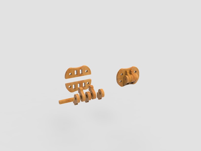 May include: Wooden toy parts, including a circular piece with hinges, a rectangular piece with holes, and several other components. The pieces are light brown and appear to be unassembled, suggesting a construction or building toy.