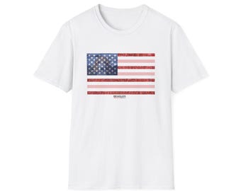 May include: White t-shirt with a red, white, and blue American flag graphic. The flag is made up of small stars and stripes. The text "BEAGLES" is printed below the flag.