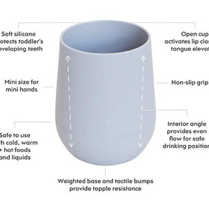 May include: A pale blue toddler cup with a non-slip grip and a weighted base. The cup is designed with a soft silicone rim to protect teeth and is suitable for cold, warm, and hot foods and liquids. It is a mini size for small hands.