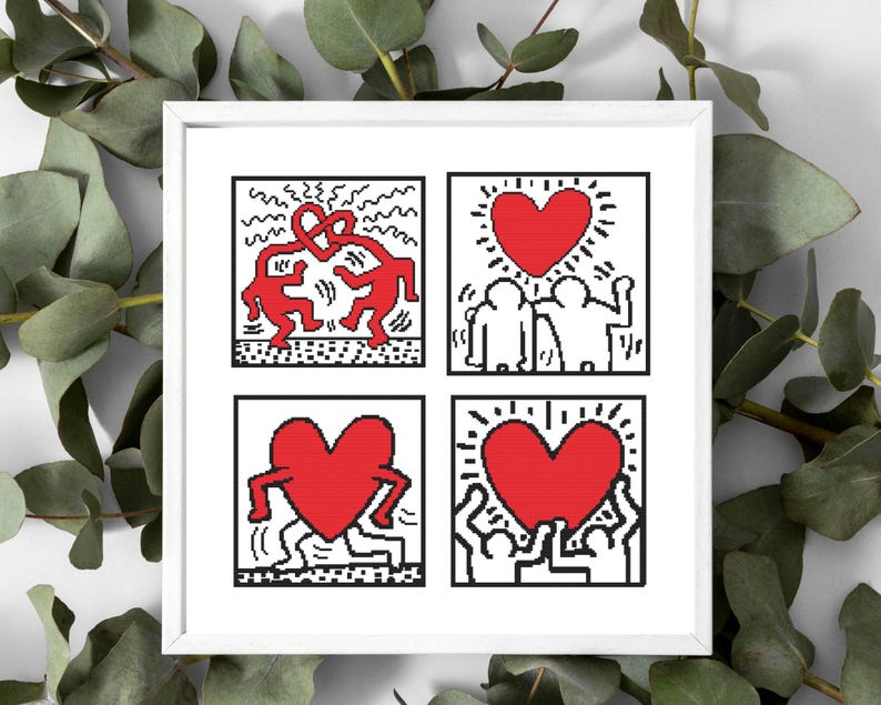 May include: A framed artwork featuring four square panels with Keith Haring-inspired designs. Each panel has a white background with black outlines and red figures, including hearts and dancing figures. The artwork is surrounded by green foliage.