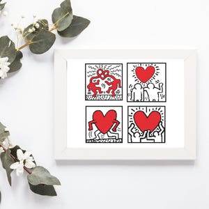 May include: A framed art print featuring four panels with Keith Haring-style illustrations. Each panel displays red hearts and figures in black and white. The artwork is in a white frame, with floral accents in the background.