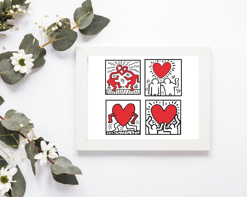 May include: A framed art print featuring four panels with Keith Haring-style illustrations. Each panel displays red hearts and figures in black and white. The artwork is in a white frame, with floral accents in the background.