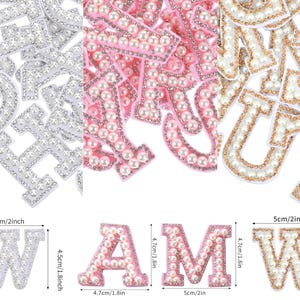May include: Selection of decorative alphabet letters in silver, pink, and gold, adorned with pearls. The letters are approximately 5cm wide and 4.5cm tall. Suitable for crafts and customisation.