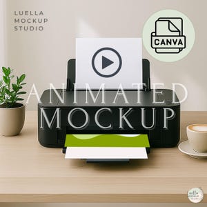 May include: A black printer with a white sheet of paper featuring a play button icon. The printer is on a light wood surface, with a small potted plant and a cup of coffee nearby. The text "ANIMATED MOCKUP" is displayed across the image.