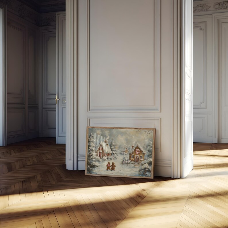 May include: A framed winter landscape painting featuring snow-covered houses and trees. The artwork depicts a cozy village scene with figures walking in the snow. The painting is set against a backdrop of a cloudy sky, creating a serene and festive atmosphere.