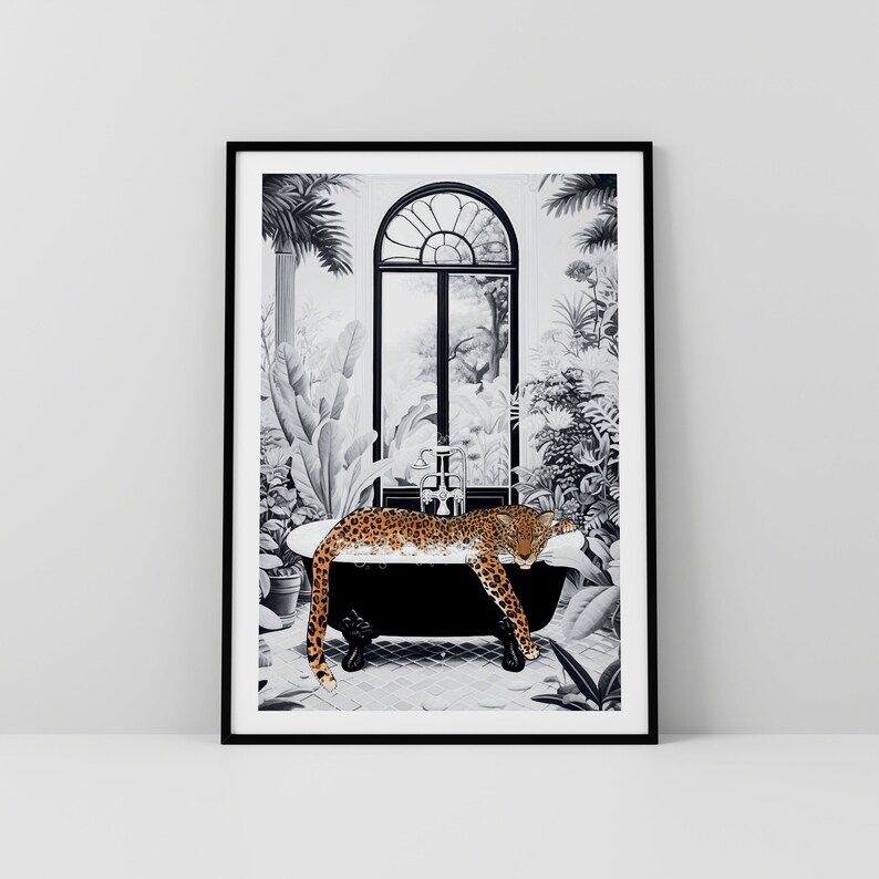 May include: A framed wall art print featuring a black and white illustration of a claw-foot bathtub in a lush tropical setting. A spotted leopard with orange and black fur rests inside the tub, which is surrounded by various potted plants.