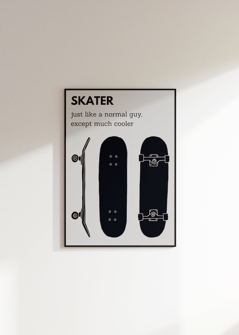May include: Black and white framed print featuring three skateboard illustrations. The text at the top reads "SKATER" with the phrase "just like a normal guy, except much cooler" below. The skateboards are depicted from different angles.