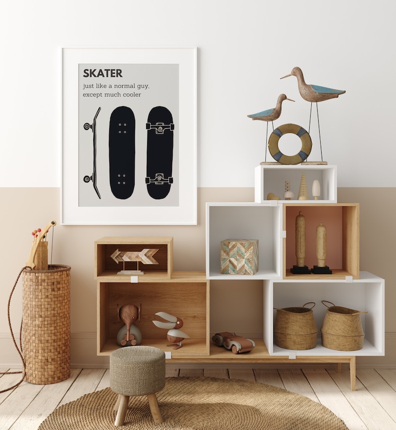 May include: A framed print with the word "SKATER" and a skateboard illustration hangs above a wooden storage unit. The unit displays decorative items, including wooden birds, a life preserver, and woven baskets. A small stool and a woven basket are in the foreground.