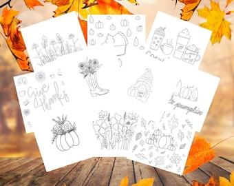 Op de afbeelding: Een verzameling zwart-wit lijntekeningen op wit papier, met herfst- en Thanksgiving-thema's. Ontwerpen omvatten pompoenen, bloemen, koffiekopjes en de tekst "Give Thanks" en "be pumpkin".