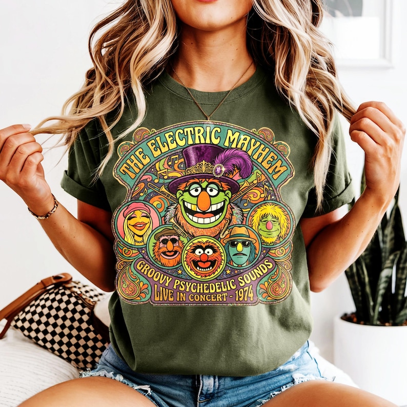 Green t-shirt with The Electric Mayhem "Groovy Psychedelic Sounds Live in Concert 1974" graphic.