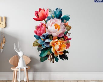 May include: A vibrant floral wall decal featuring a bouquet of peonies and other flowers in shades of red, pink, orange, blue, and green. The decal is applied to a white wall, creating a colorful accent. The image also includes a small wooden chair with a white bunny figurine.