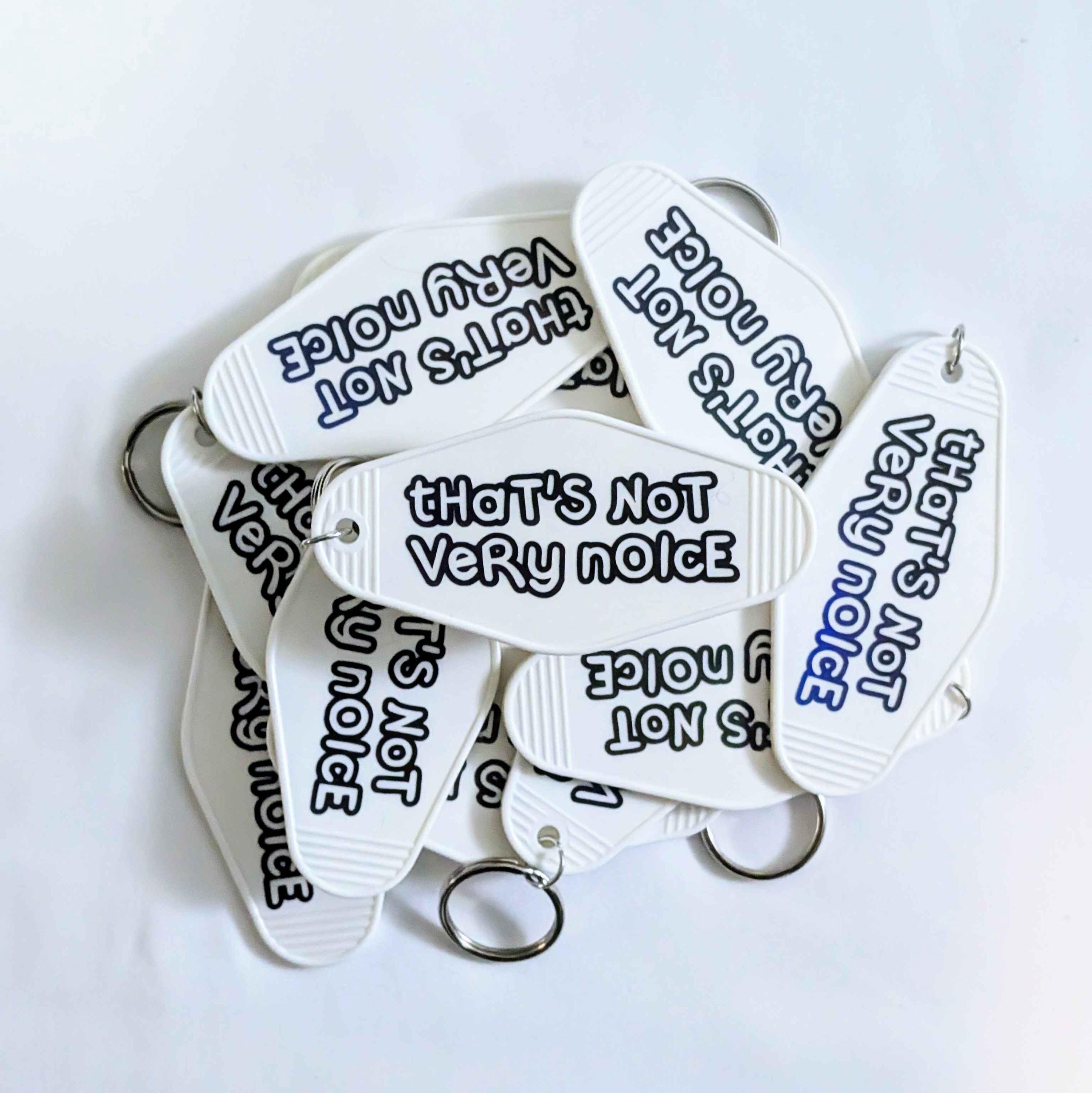 Stray Kids SKZ that's not very noice White and Black Oil Slick Keychain
