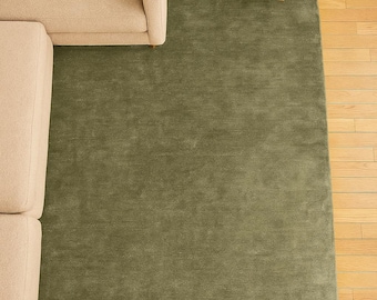 Handloom Wool Rug in soft sage green solid minimalist area rug with heathered texture and hand-sheared low pile; calming eucalyptus tone