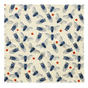 May include: A cream-colored fabric with a repeating pattern of blue cicadas and orange dots.