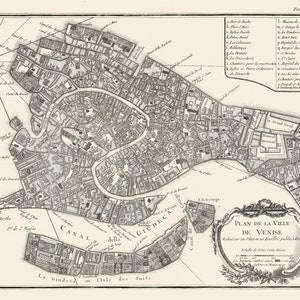 May include: An antique black and white map of Venice, Italy, featuring canals, buildings, and streets. The map includes text in French and Italian, with a decorative border and scale. The map is printed on aged paper.