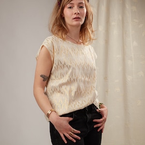 Women&#39;s shimmering blouse with short sleeves, oversized straight cut, ecru or black with lurex threads