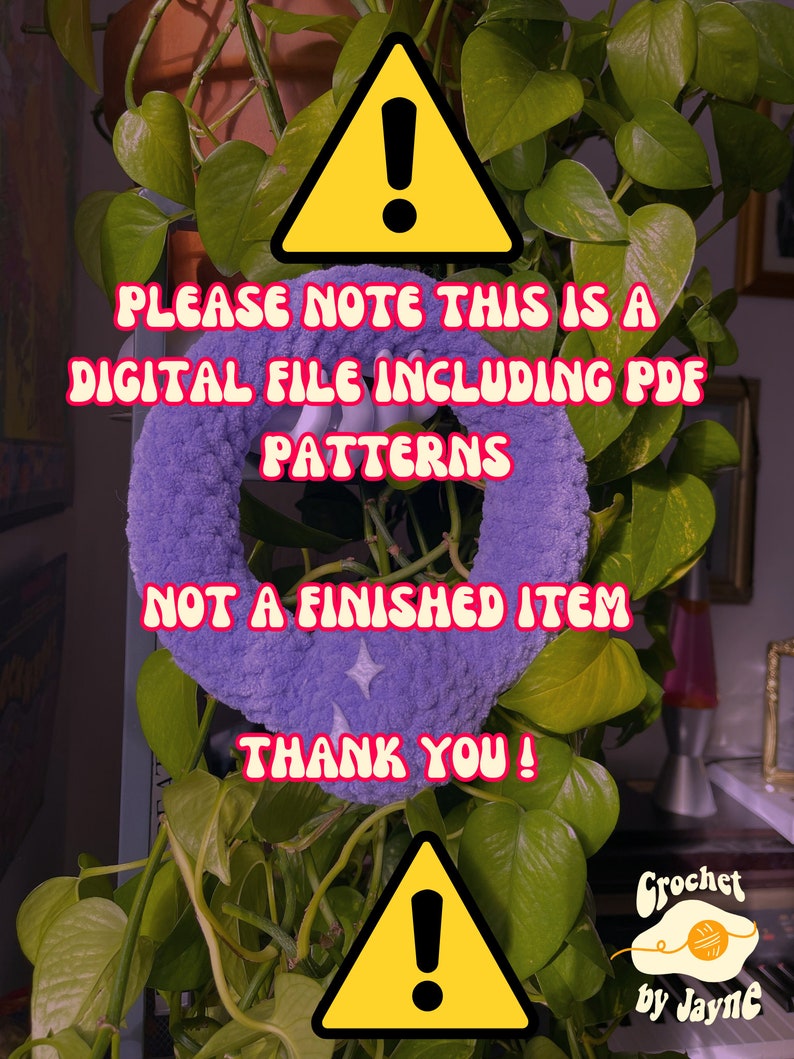 May include: A yellow warning sign with an exclamation point inside. The text reads "Please note this is a digital file including PDF patterns. Not a finished item. Thank you!"  A purple crocheted item is in the background.