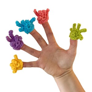 May include: A hand with six colorful, crocheted finger puppets. The puppets are in the shape of hands, each in a different color: yellow, purple, blue, coral, and green. The background is plain white.