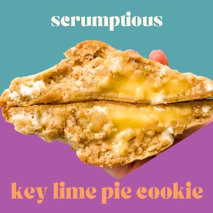 May include: A close-up of a key lime pie cookie, split in half, revealing a bright yellow key lime filling. The cookie is light brown and has a slightly crumbly texture. The text "scrumptious" is written in white letters on a teal background above the cookie, and the text "key lime pie cookie" is written in orange letters on a purple background below the cookie.