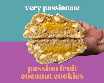 May include: A close-up of a passion fruit coconut cookie, split in half to reveal a bright yellow passion fruit filling. The cookie is light brown and has white chocolate chips. The text "very passionate" is above the cookie and "passion fruit coconut cookies" is below.