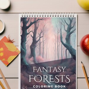 Peut inclure: Un livre de coloriage à spirales intitulé "Fantasy Forests" présentant une illustration détaillée d'une forêt mystique avec de grands arbres dénudés et un cours d'eau. La couverture présente une palette de teintes turquoise, rose et violet. Des crayons et des fruits sont également visibles.