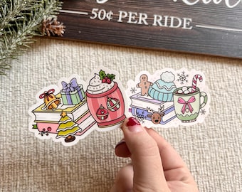 May include: A colorful sticker featuring Christmas-themed illustrations. The sticker includes images of a stack of books, a Christmas tree, a gift, a cup of hot chocolate, a gingerbread man, a mug of hot cocoa, and the text "Sleigh Ride 50¢ PER RIDE".