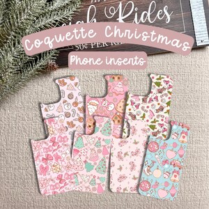 May include: A collection of phone inserts with a "Coquette Christmas" theme. The inserts feature various pastel patterns with Christmas-themed illustrations, including gingerbread men, bows, Christmas trees, and ornaments. The inserts are in shades of pink, blue, and white.