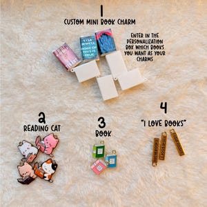 May include: A collection of book-themed charms, including miniature book charms, reading cat charms, and charms with the text "I Love Books." The image also features the text "Custom Mini Book Charm."