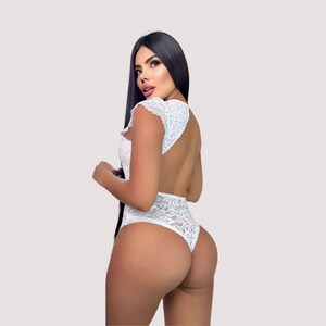White bridal lace bodysuit perfect for wedding night, honeymoon, bridal photos, anniversaries, or romantic evenings. Elegant yet alluring design adds confidence and charm for special intimate occasions.
