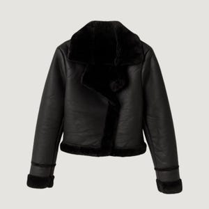 May include: A black faux leather jacket with a faux fur collar and trim. The jacket has a classic aviator style with a notched collar, long sleeves, and a cropped length. The jacket is a solid black color.