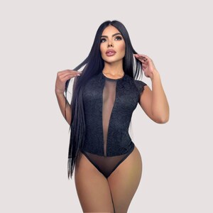 Soft white lace and smooth sheer mesh bodysuit with lightweight breathable feel. Floral lace adds delicate texture, while the deep plunge front and fitted shape feel sleek, flattering, and sensual against the skin.