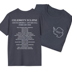 May include: A dark blue t-shirt with white text that reads "CELEBRITY ECLIPSE" and lists a tour itinerary for South America and Antarctica in February 2024.