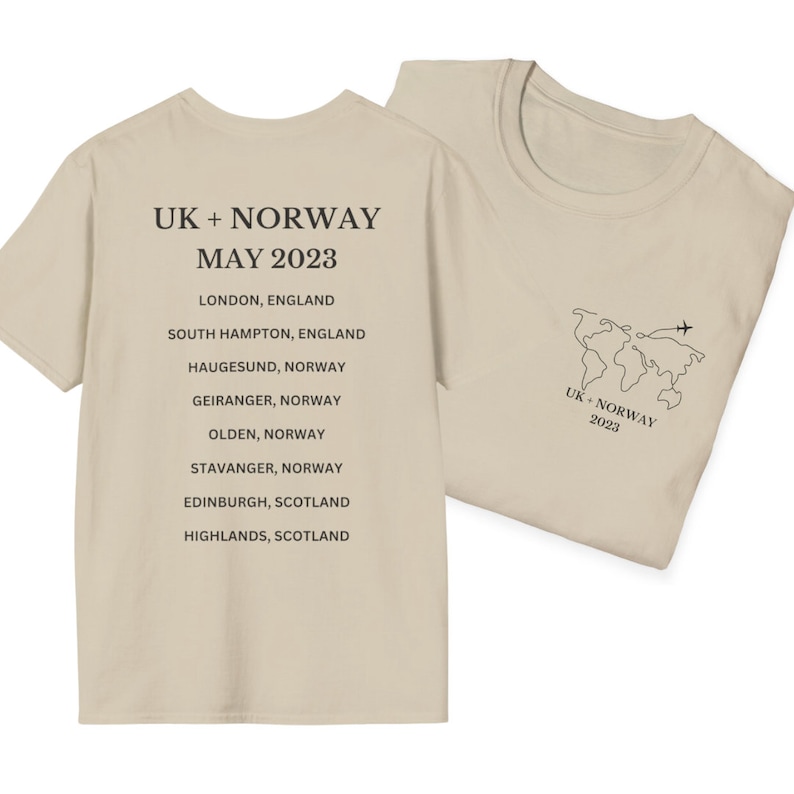 May include: A beige t-shirt with the text "UK + NORWAY MAY 2023" and a list of cities in the UK and Norway. The back of the shirt has a world map with a plane flying over it and the text "UK + NORWAY 2023".