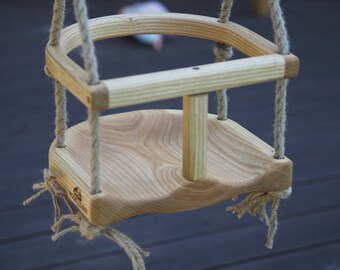 Wooden handmade swing made of oiled ash wood