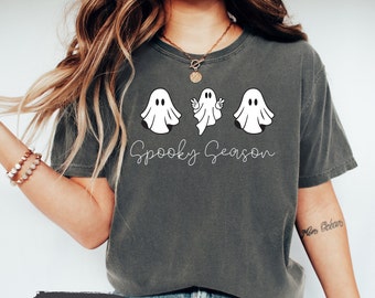 May include: A gray t-shirt with a white graphic of three ghosts and the text "Spooky Season".