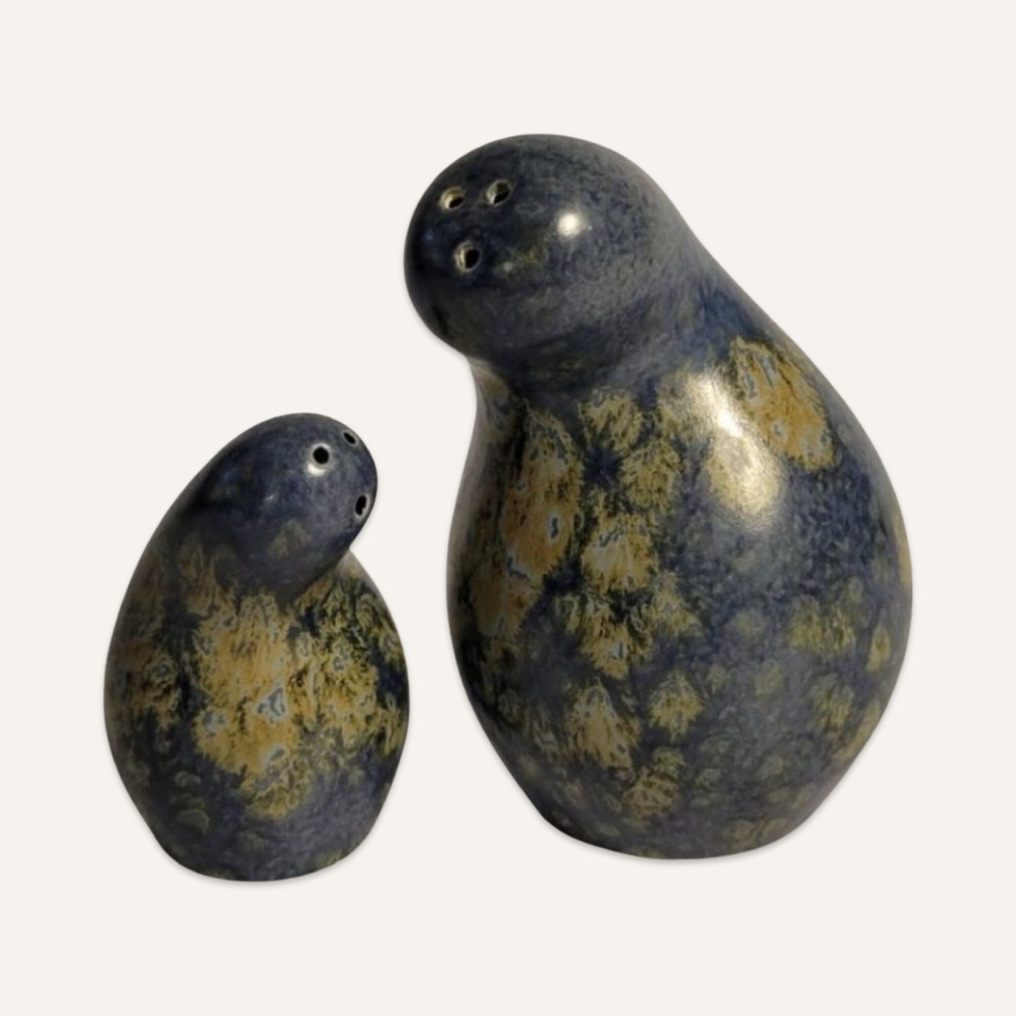 1990s Pair of Eva Zeisel Abstract Form Earthenware Salt and Pepper Shakers in a Unique Glaze.