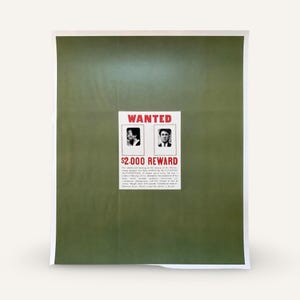 May include: A vintage-style poster with a green background and a white border. The poster features a "WANTED" header and two black and white portraits. Below the portraits is the text "$2.000 REWARD".