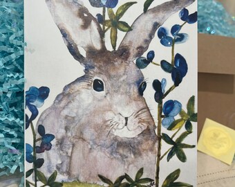5 X 7 Notecard of gray bunny in bluebonnets which is perfect for Easter and springtime.  Kraft envelope and gold seal included.
