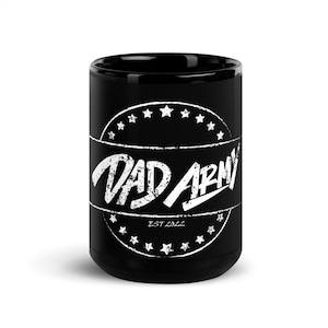 May include: Black ceramic coffee mug with a white circle design featuring the text "DAD ARMY" and "EST 2022" in a distressed font.