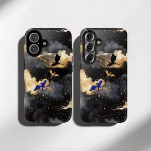 May include: Two black phone cases with a fantasy-themed design. The cases feature a dark background with gold clouds, black dragons, and blue dragons. The cases have camera cutouts and a glossy finish.
