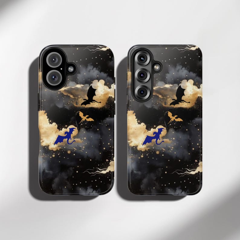 May include: Two black phone cases with a fantasy-themed design. The cases feature a dark background with gold clouds, black dragons, and blue dragons. The cases have camera cutouts and a glossy finish.